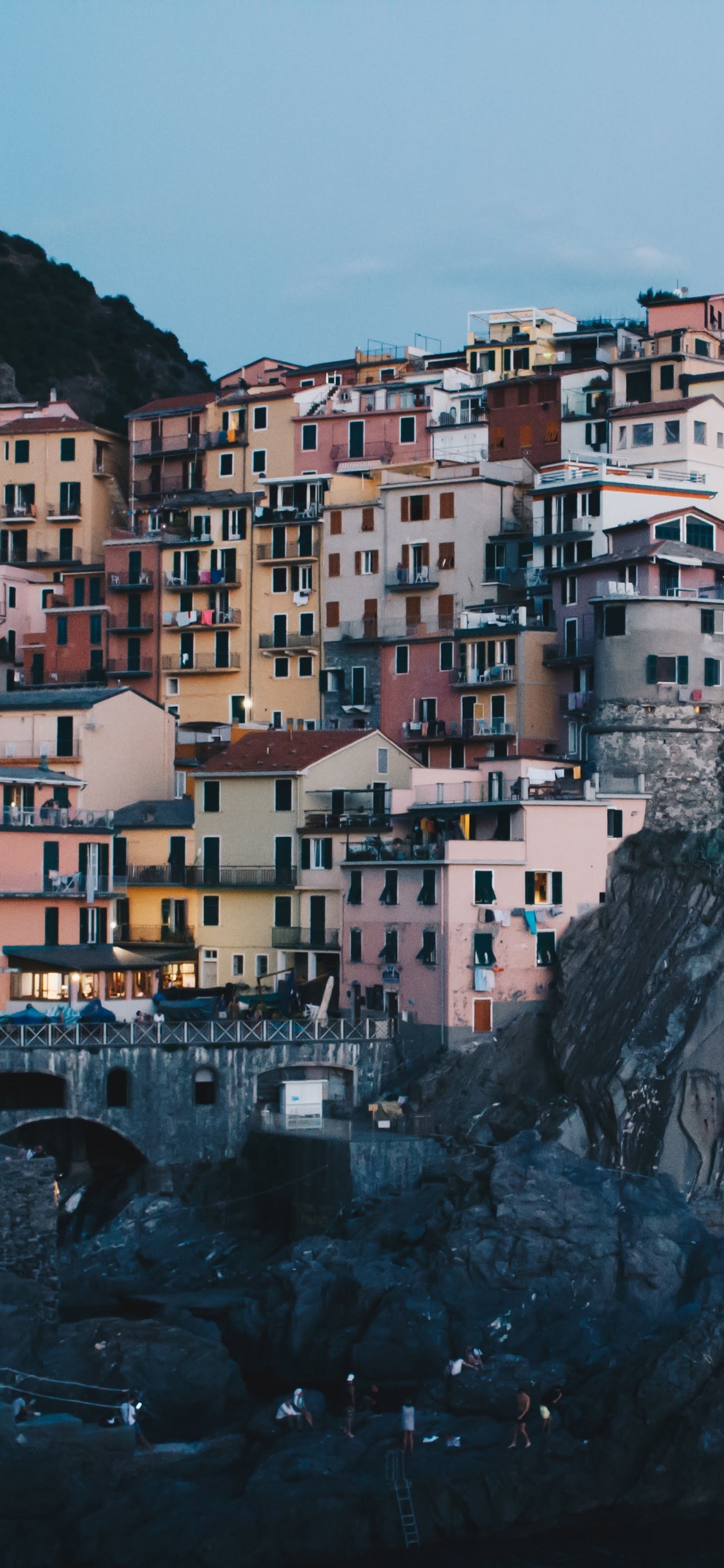 White and Brown Concrete Buildings on Mountain. Wallpaper in 1242x2688 Resolution