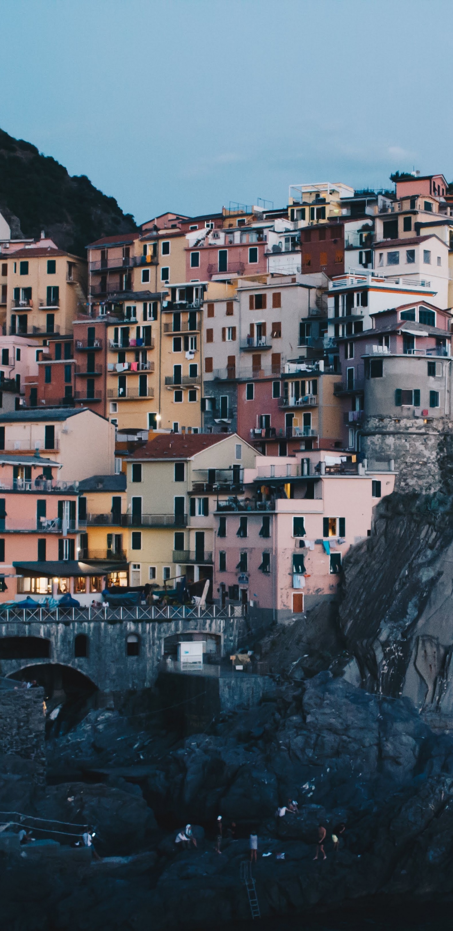 White and Brown Concrete Buildings on Mountain. Wallpaper in 1440x2960 Resolution