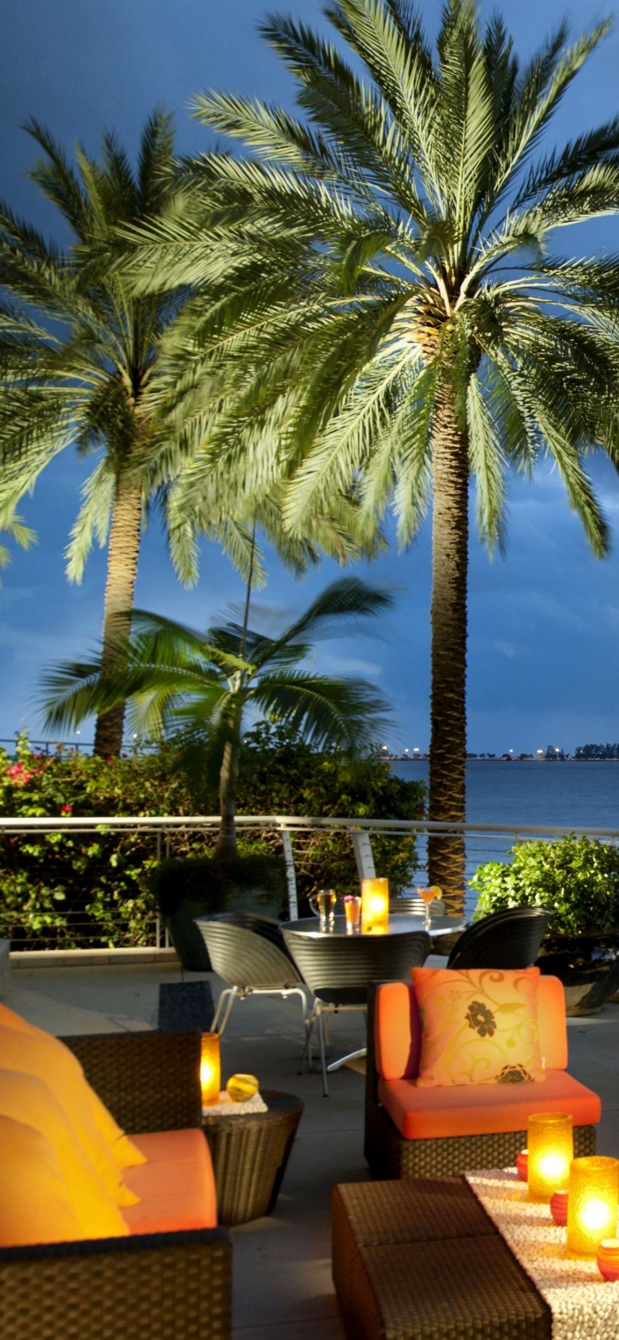 Brown and White Dining Table and Chairs Near Body of Water During Daytime. Wallpaper in 1242x2688 Resolution