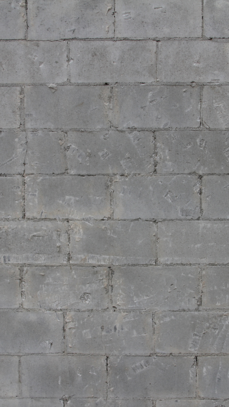 Grey Brick Wall During Daytime. Wallpaper in 750x1334 Resolution