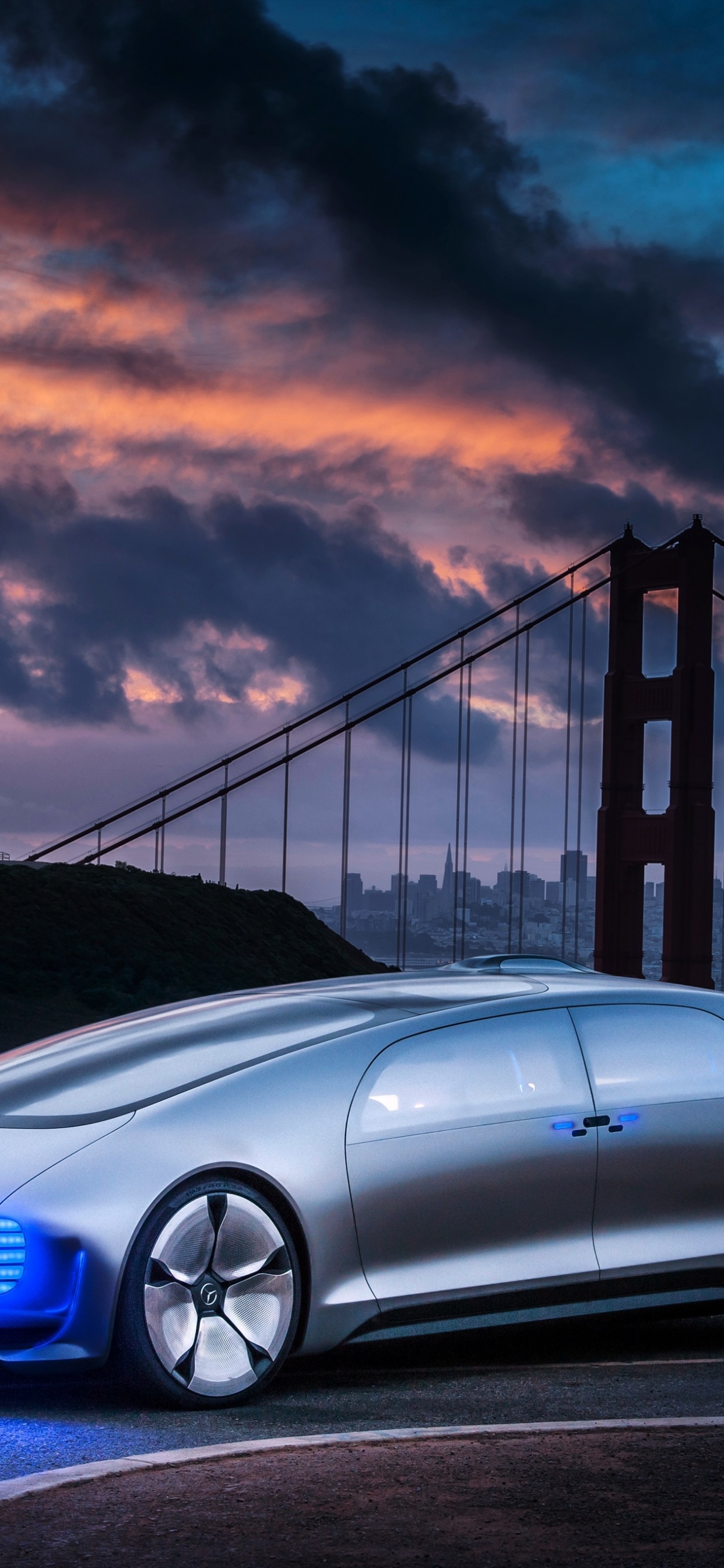 Blue Bmw m 3 Coupe on Bridge Under Cloudy Sky. Wallpaper in 1242x2688 Resolution