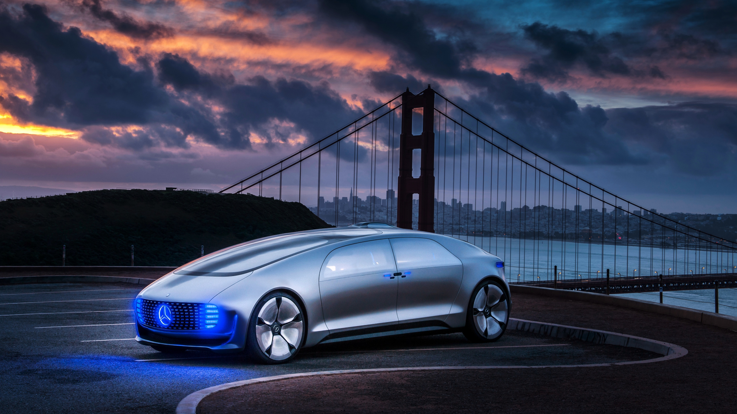 Blue Bmw m 3 Coupe on Bridge Under Cloudy Sky. Wallpaper in 2560x1440 Resolution