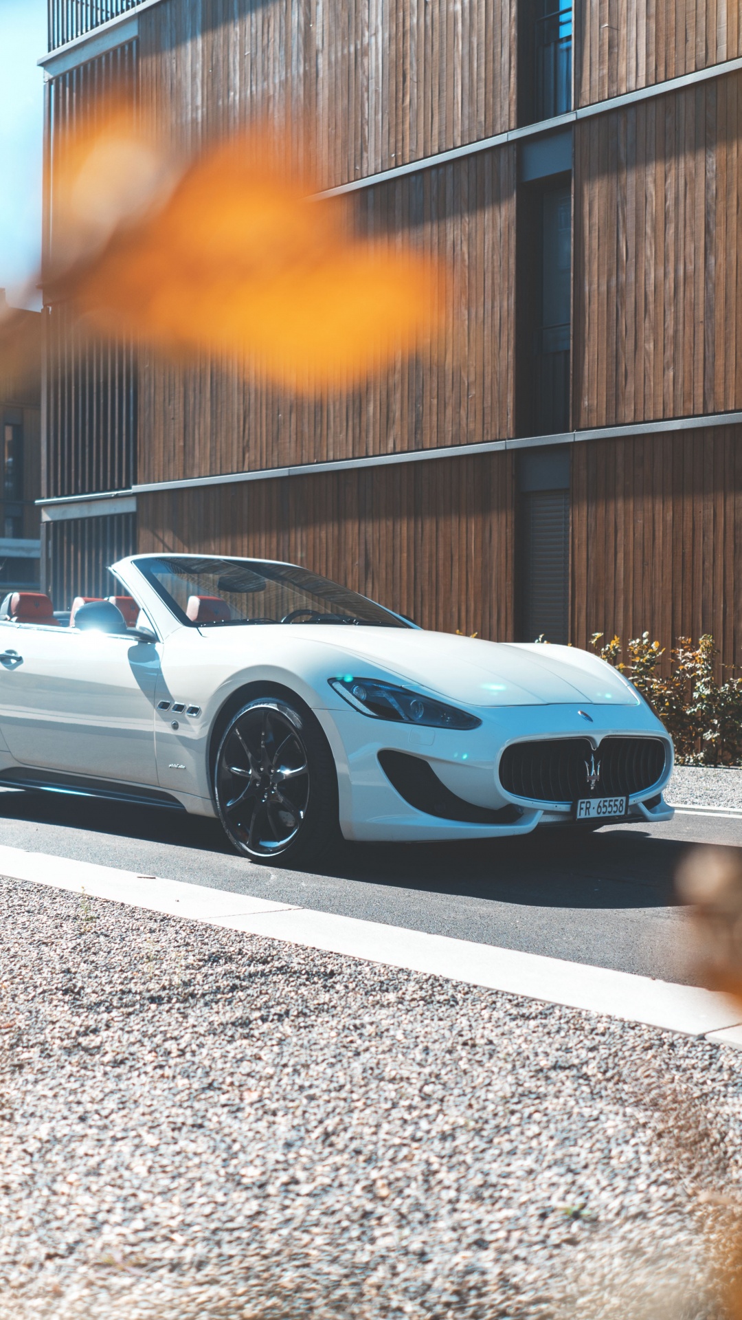 White Coupe Parked on Gray Concrete Road During Daytime. Wallpaper in 1080x1920 Resolution