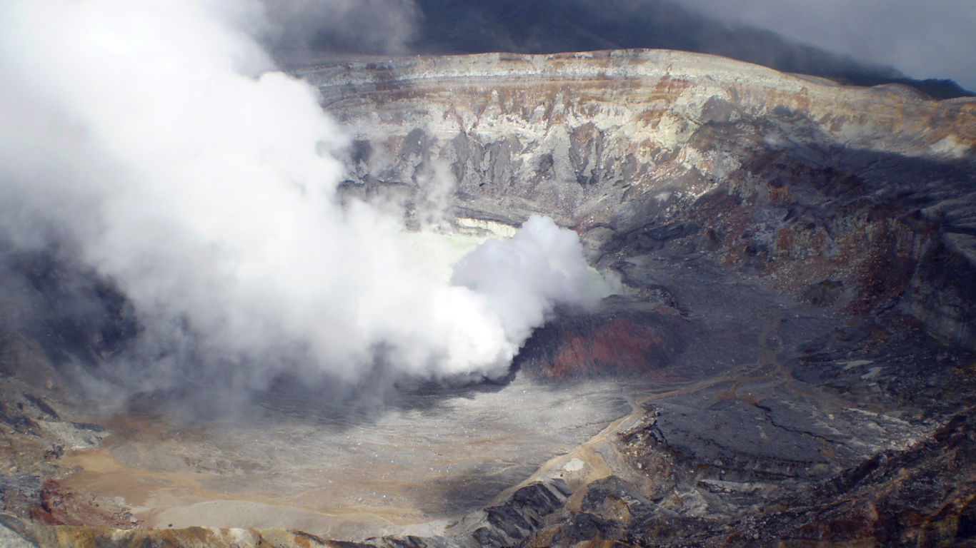White Smoke Coming From Brown and Gray Mountain. Wallpaper in 1366x768 Resolution