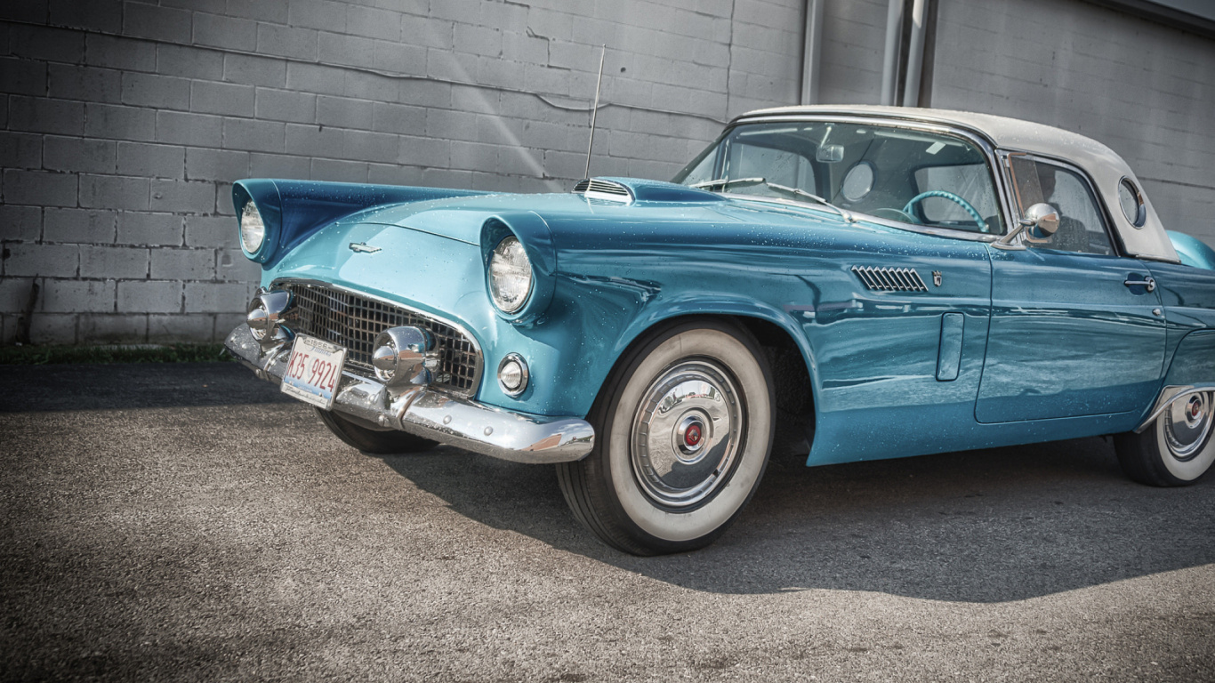 Blue Classic Car Parked on Gray Concrete Pavement During Daytime. Wallpaper in 1366x768 Resolution