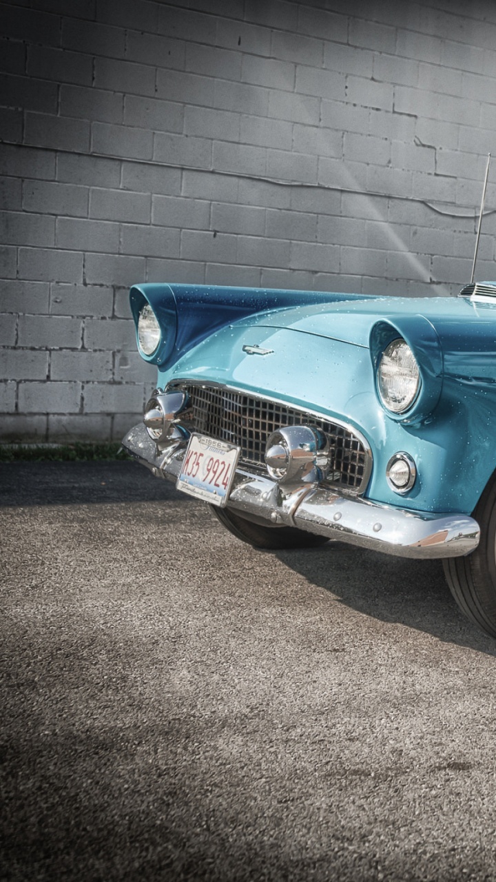 Blue Classic Car Parked on Gray Concrete Pavement During Daytime. Wallpaper in 720x1280 Resolution
