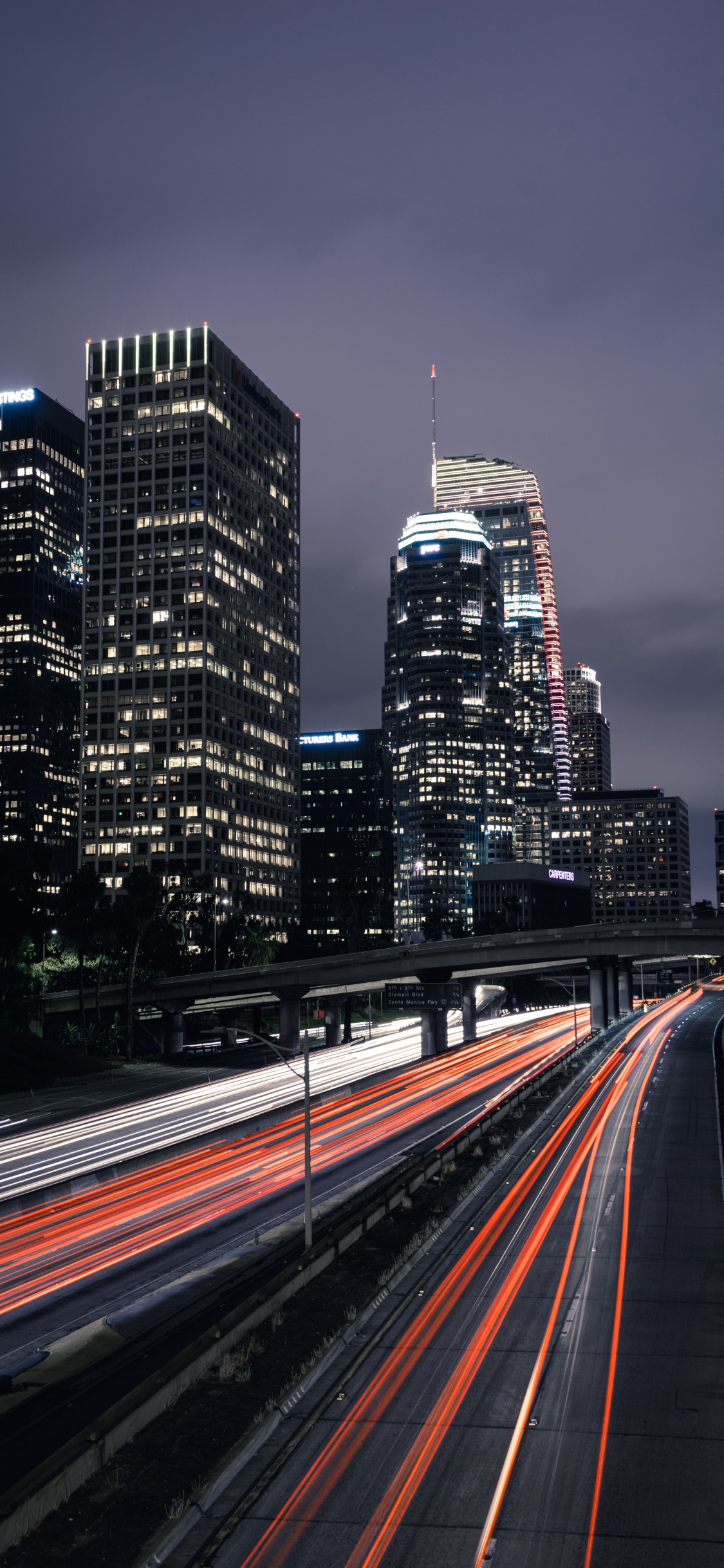 Time Lapse Photography of City During Night Time. Wallpaper in 1125x2436 Resolution