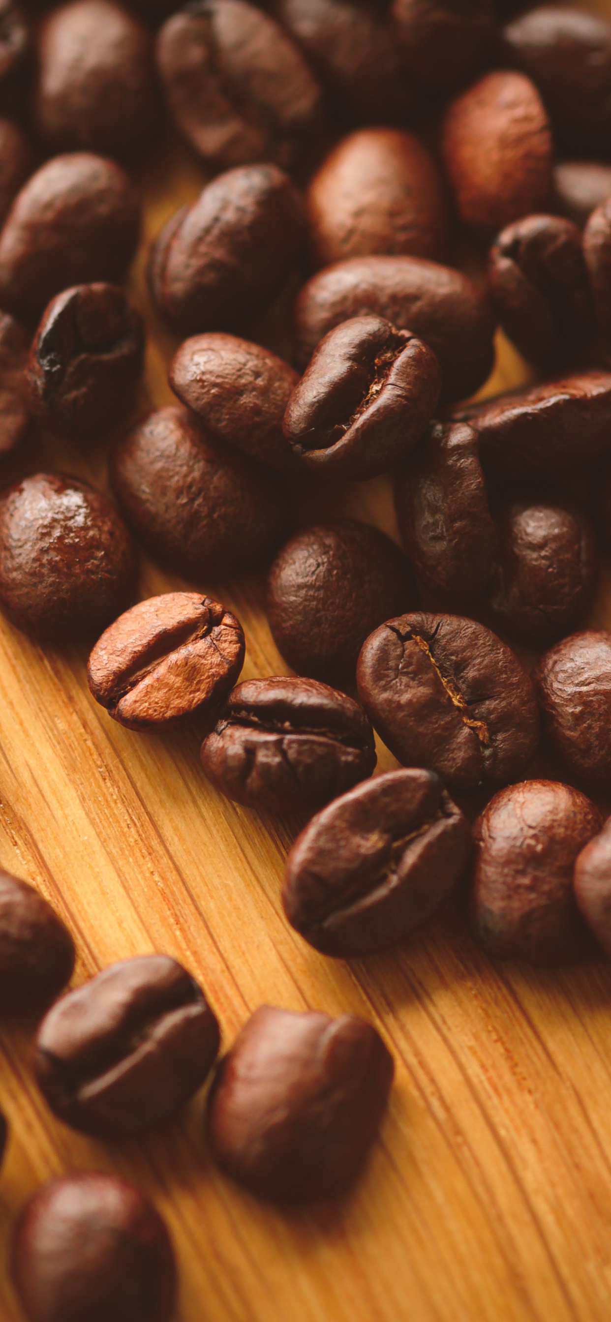 Coffee Beans on Brown Wooden Table. Wallpaper in 1242x2688 Resolution