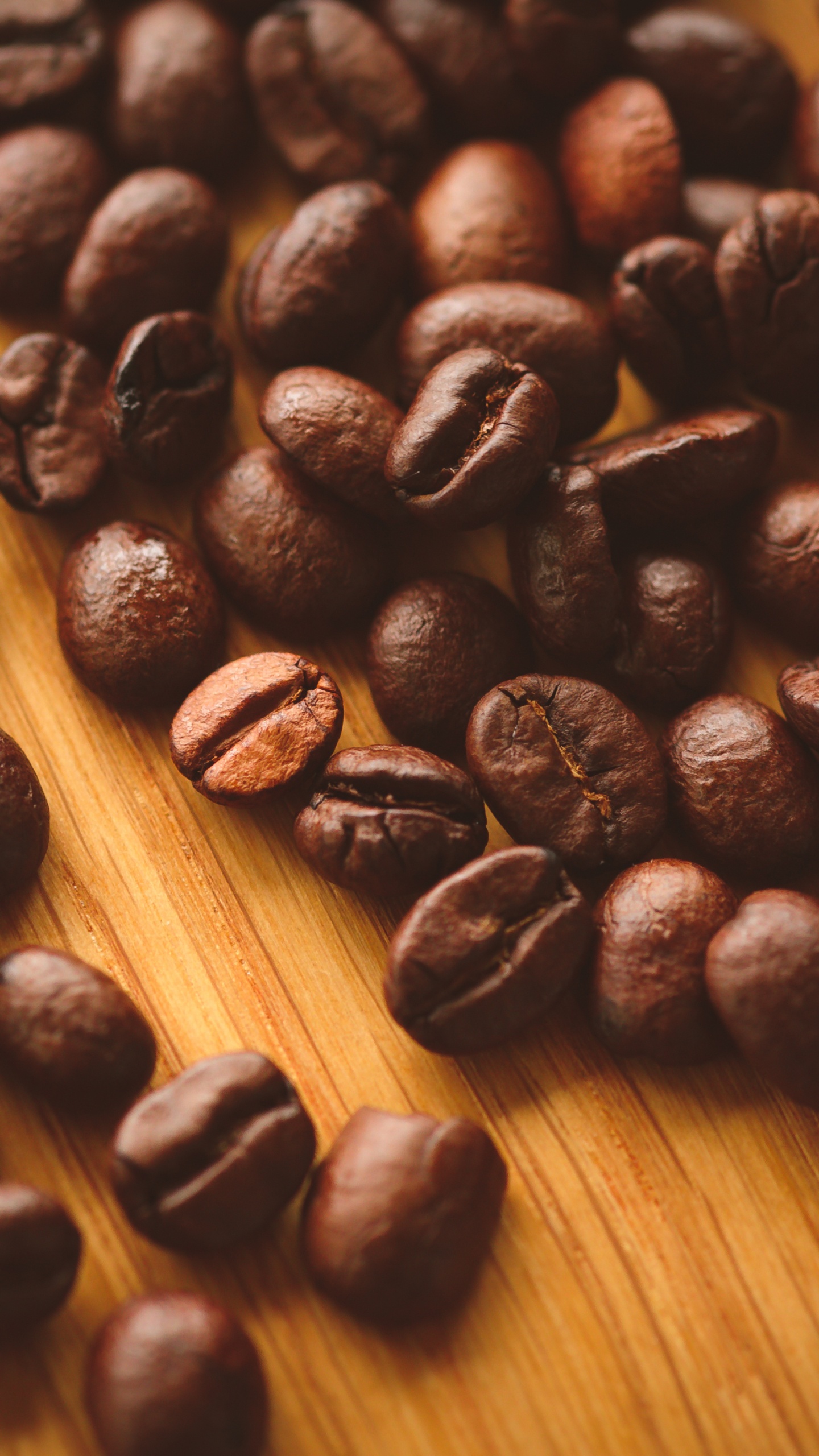 Coffee Beans on Brown Wooden Table. Wallpaper in 1440x2560 Resolution