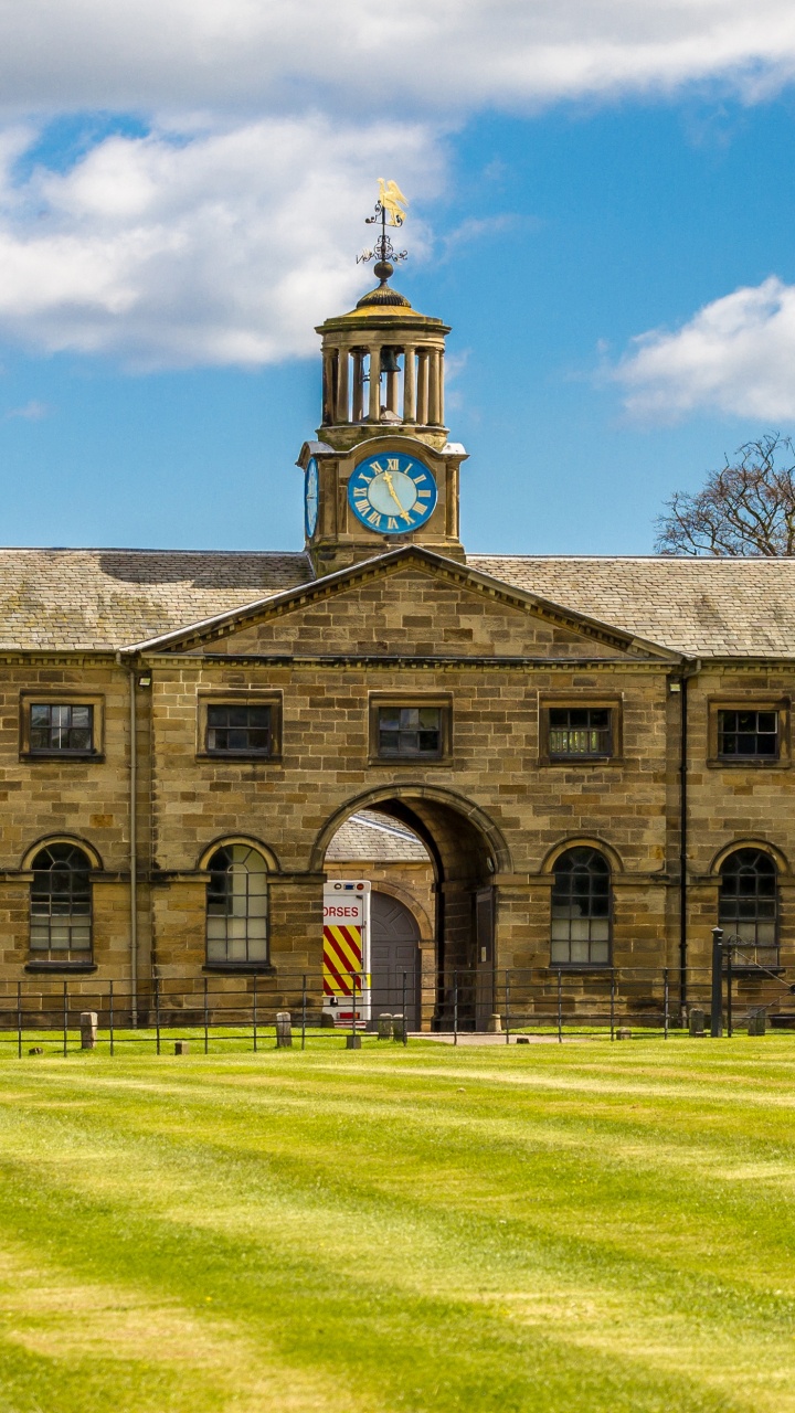 Brown Concrete Building Under Blue Sky During Daytime. Wallpaper in 720x1280 Resolution