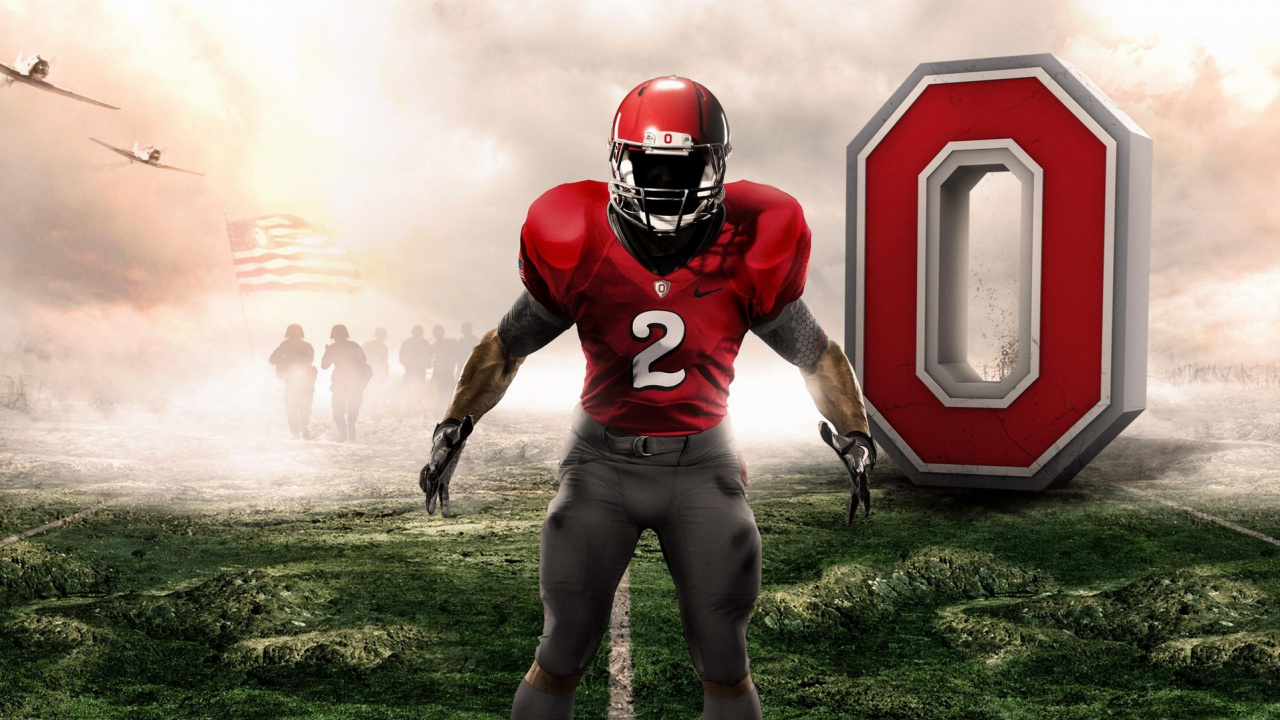 Football Player in Red and Gray Jersey Shirt and Gray Pants Standing on Green Grass Field. Wallpaper in 1280x720 Resolution