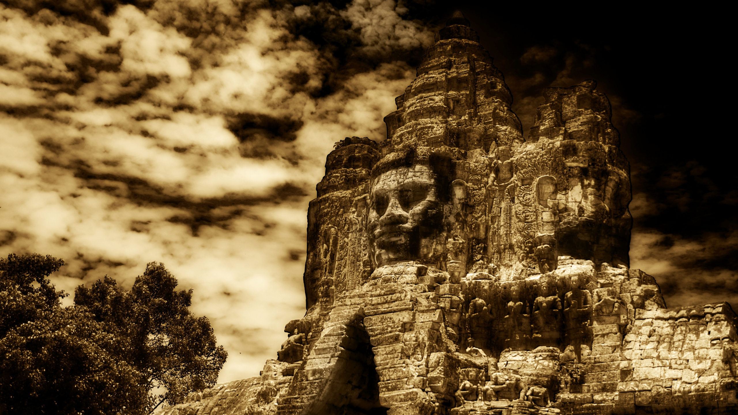 Brown Rock Formation Under Cloudy Sky. Wallpaper in 2560x1440 Resolution