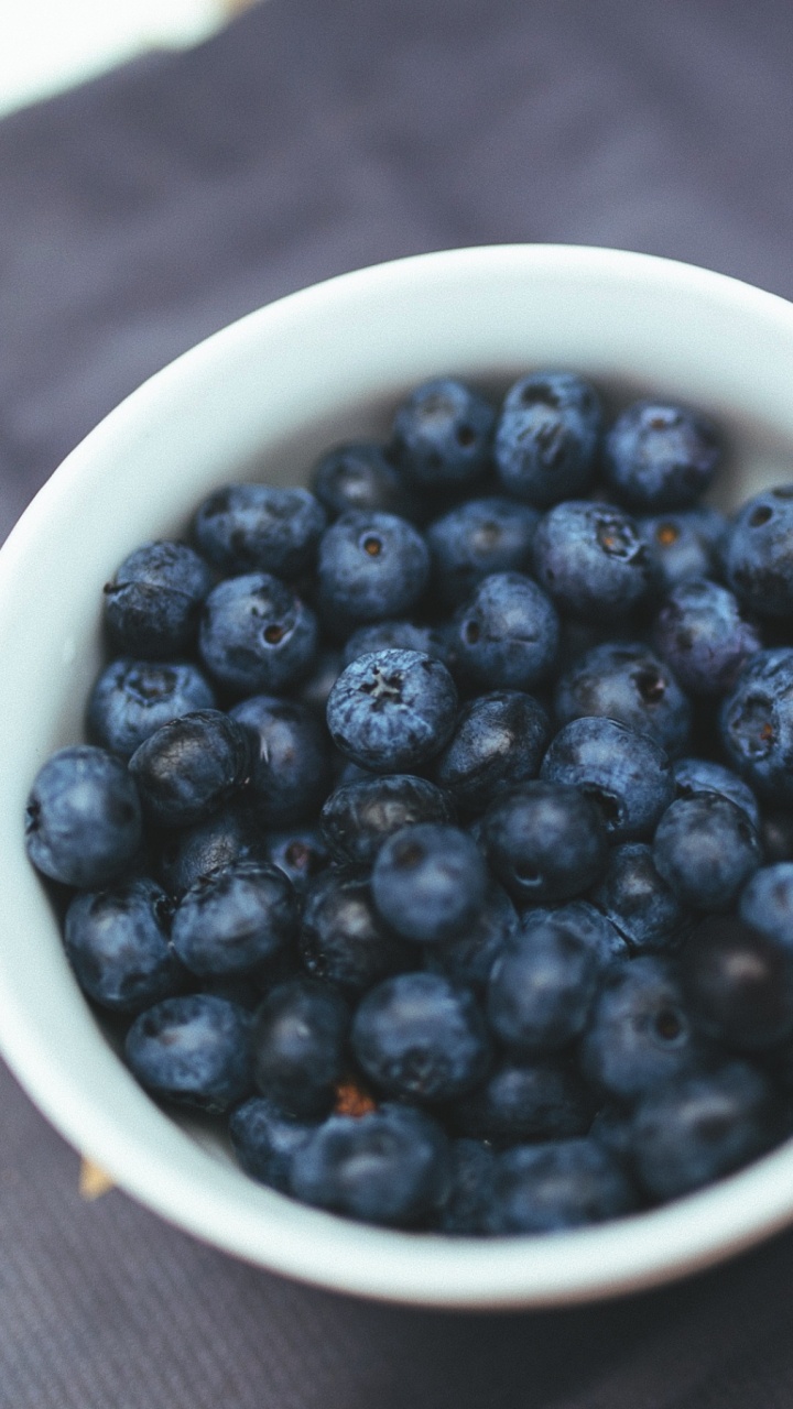Black Round Fruits in White Ceramic Bowl. Wallpaper in 720x1280 Resolution