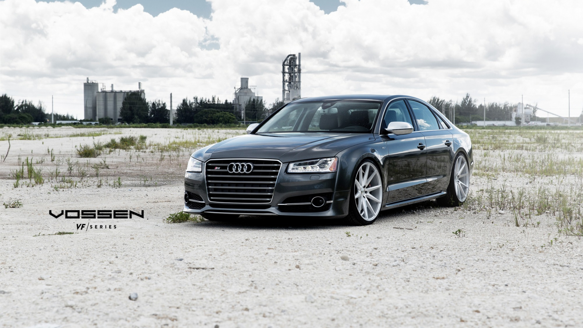 Coupé Audi Bleu Sur Champ Brun Sous Des Nuages Blancs Pendant la Journée. Wallpaper in 1920x1080 Resolution