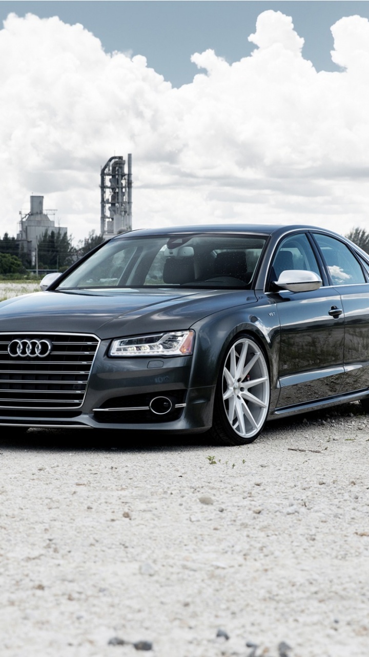 Coupé Audi Bleu Sur Champ Brun Sous Des Nuages Blancs Pendant la Journée. Wallpaper in 720x1280 Resolution