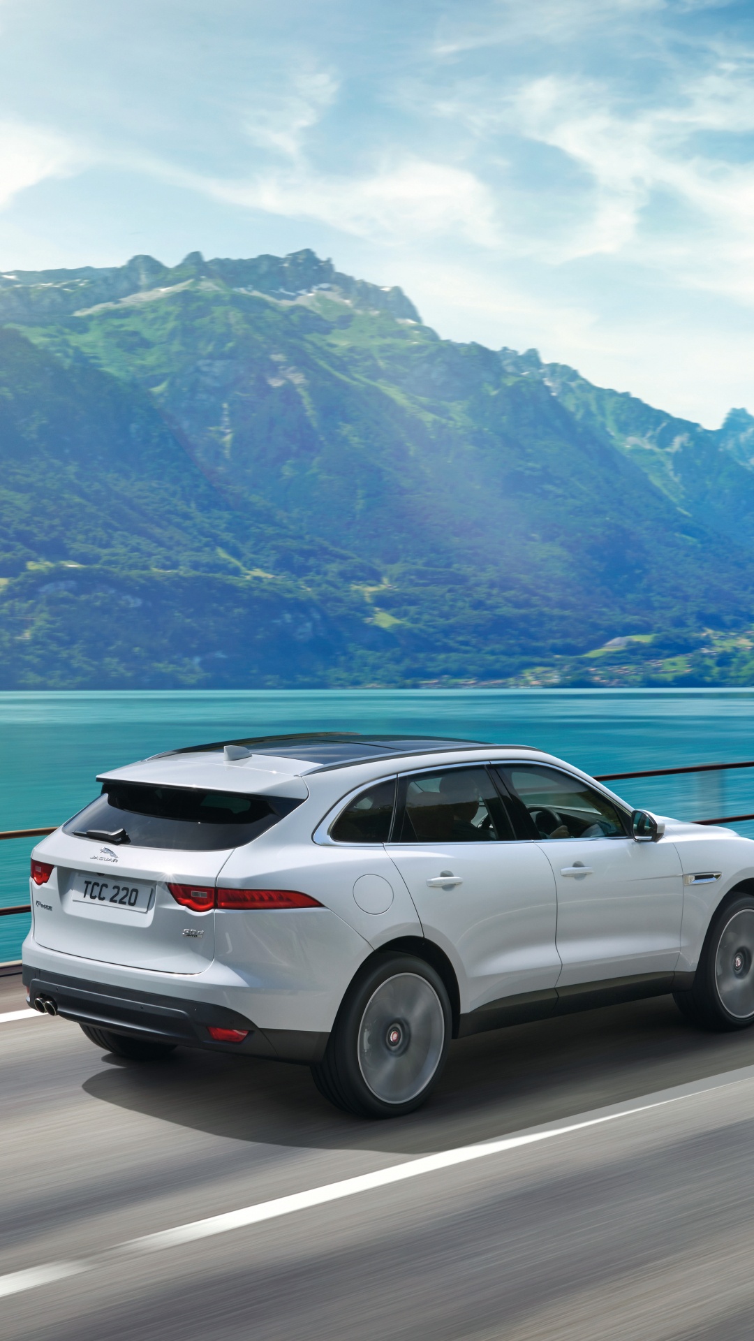 Suv Blanco en la Carretera Cerca Del Cuerpo de Agua Durante el Día. Wallpaper in 1080x1920 Resolution