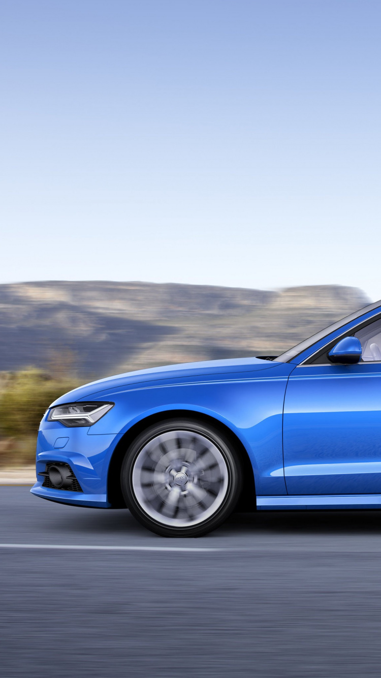 Blue Sedan on Gray Asphalt Road. Wallpaper in 750x1334 Resolution