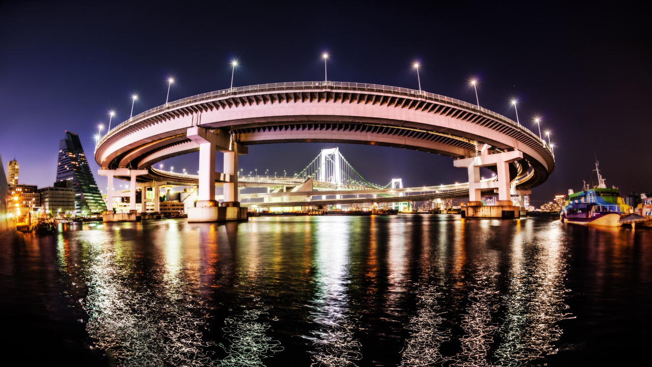 White and Brown Bridge Over Body of Water During Night Time. Wallpaper in 1280x720 Resolution