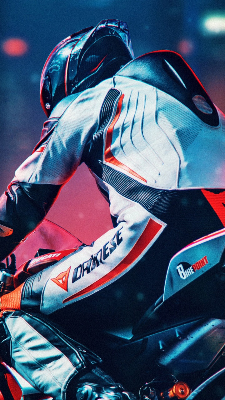 Homme en Costume de Moto Rouge et Noir à Cheval Sur un Vélo de Sport Rouge et Noir. Wallpaper in 720x1280 Resolution