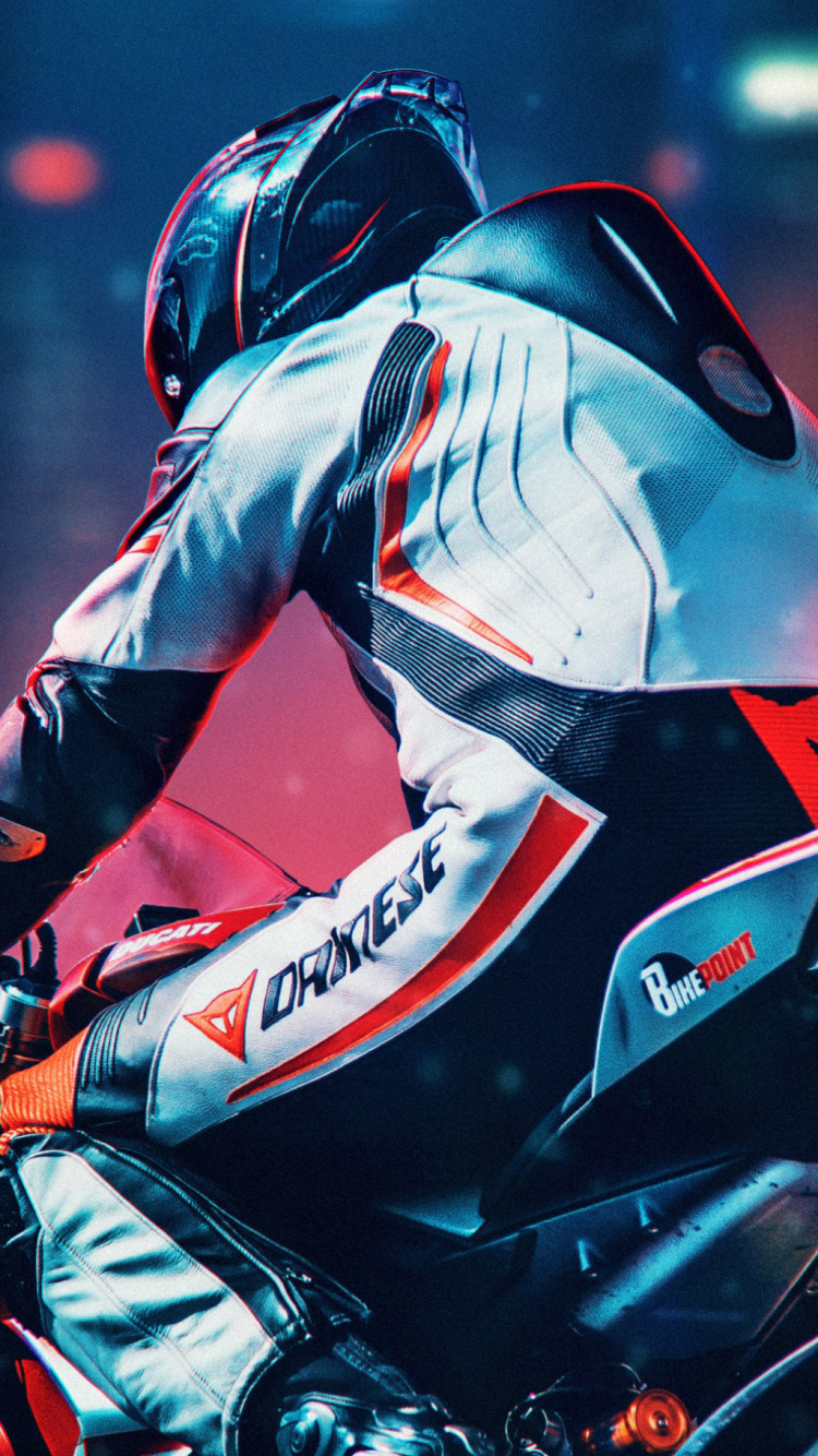 Homme en Costume de Moto Rouge et Noir à Cheval Sur un Vélo de Sport Rouge et Noir. Wallpaper in 750x1334 Resolution