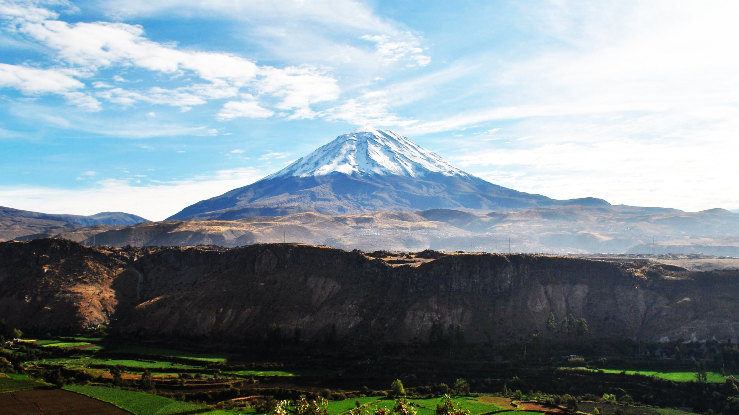 Green and Brown Mountain Under Blue Sky During Daytime. Wallpaper in 2560x1440 Resolution