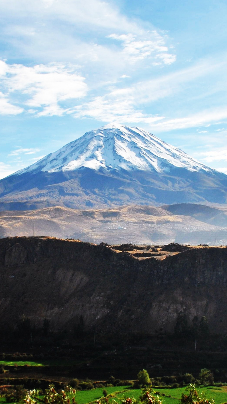 Green and Brown Mountain Under Blue Sky During Daytime. Wallpaper in 750x1334 Resolution