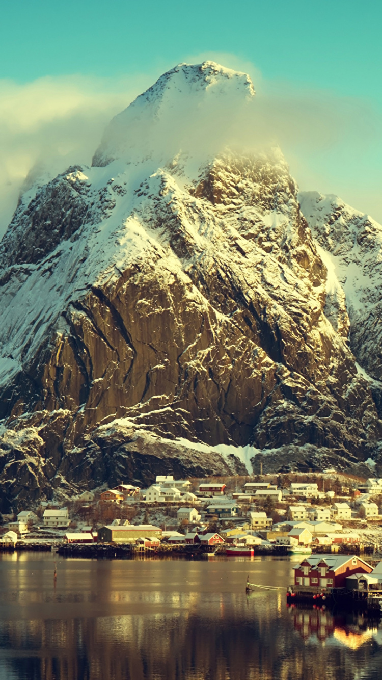 White and Brown Mountain Near Body of Water During Daytime. Wallpaper in 750x1334 Resolution