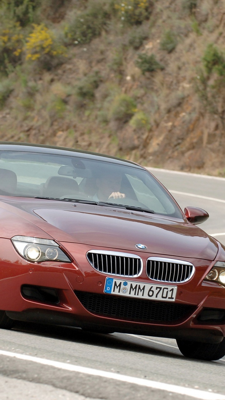 Audi Coupe Rojo en la Carretera Durante el Día. Wallpaper in 720x1280 Resolution