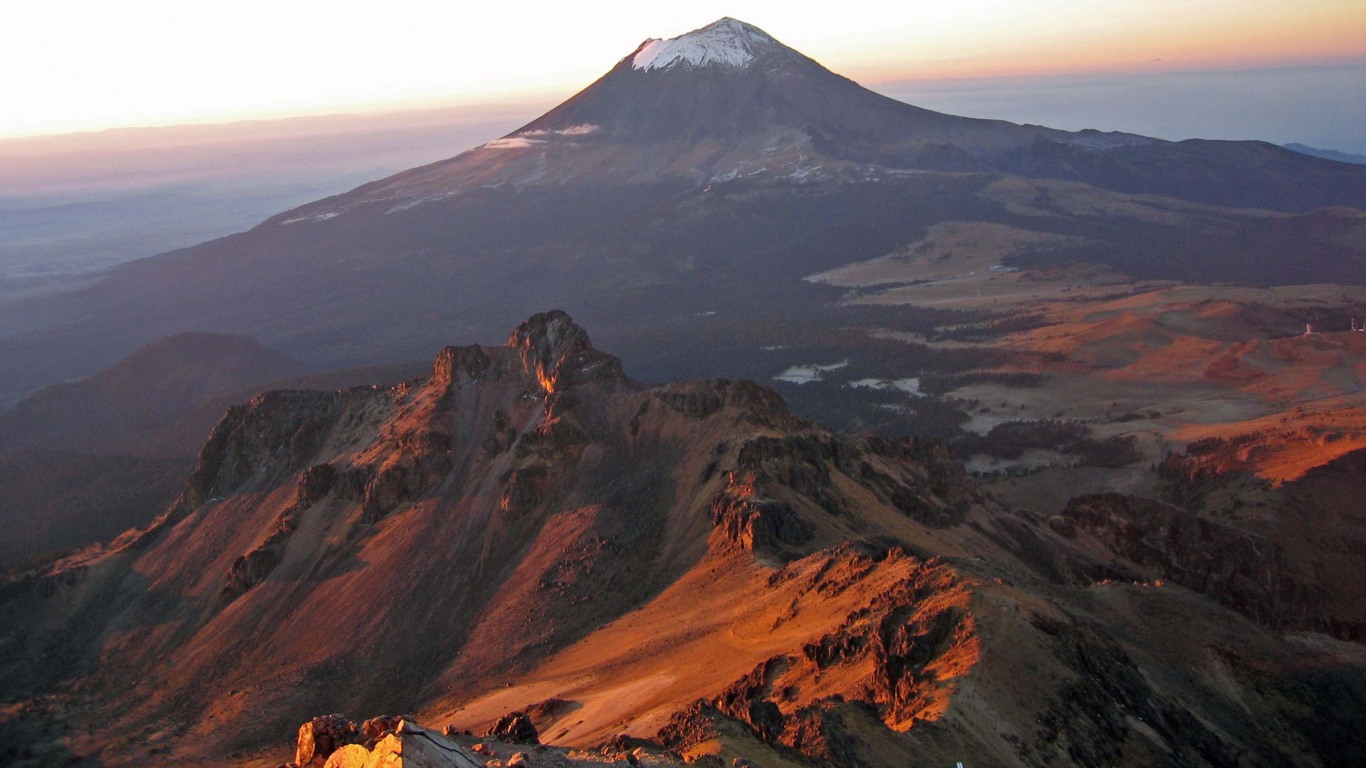 Brown and White Mountain Under White Clouds During Daytime. Wallpaper in 1366x768 Resolution