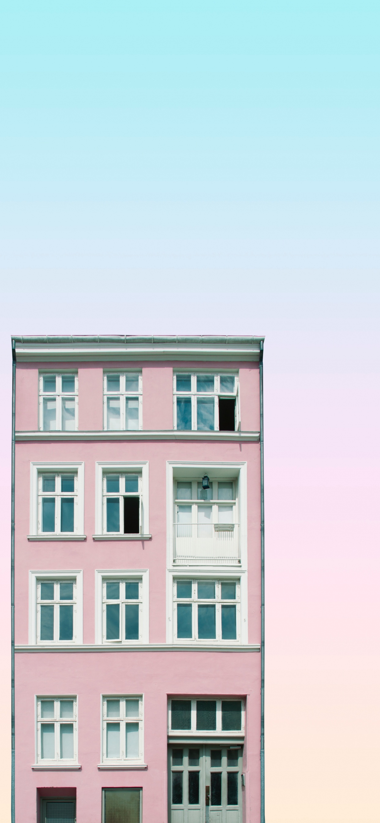 Pink Concrete Building Under White Sky During Daytime. Wallpaper in 1242x2688 Resolution