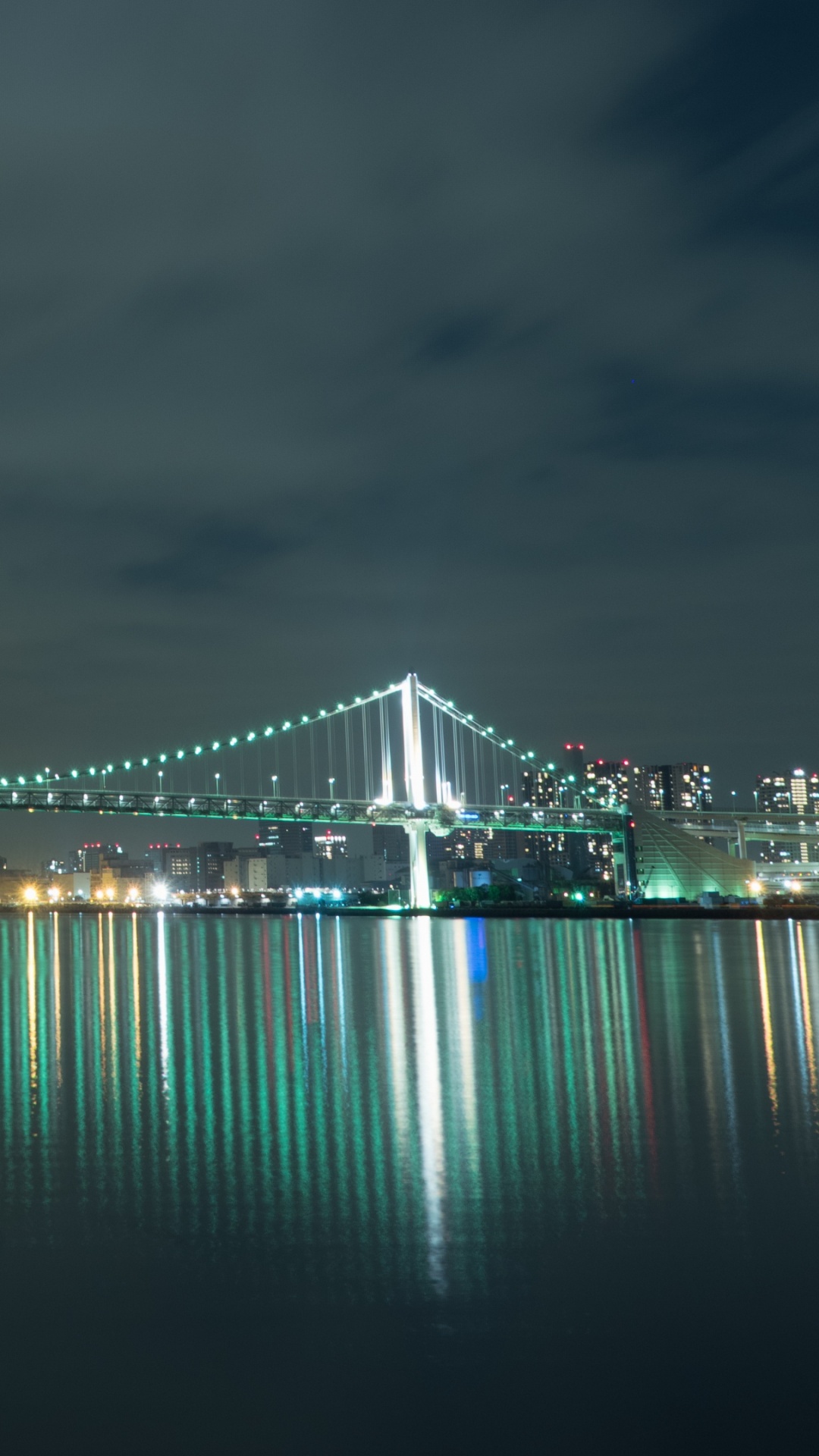 Bridge Over Water During Night Time. Wallpaper in 1080x1920 Resolution