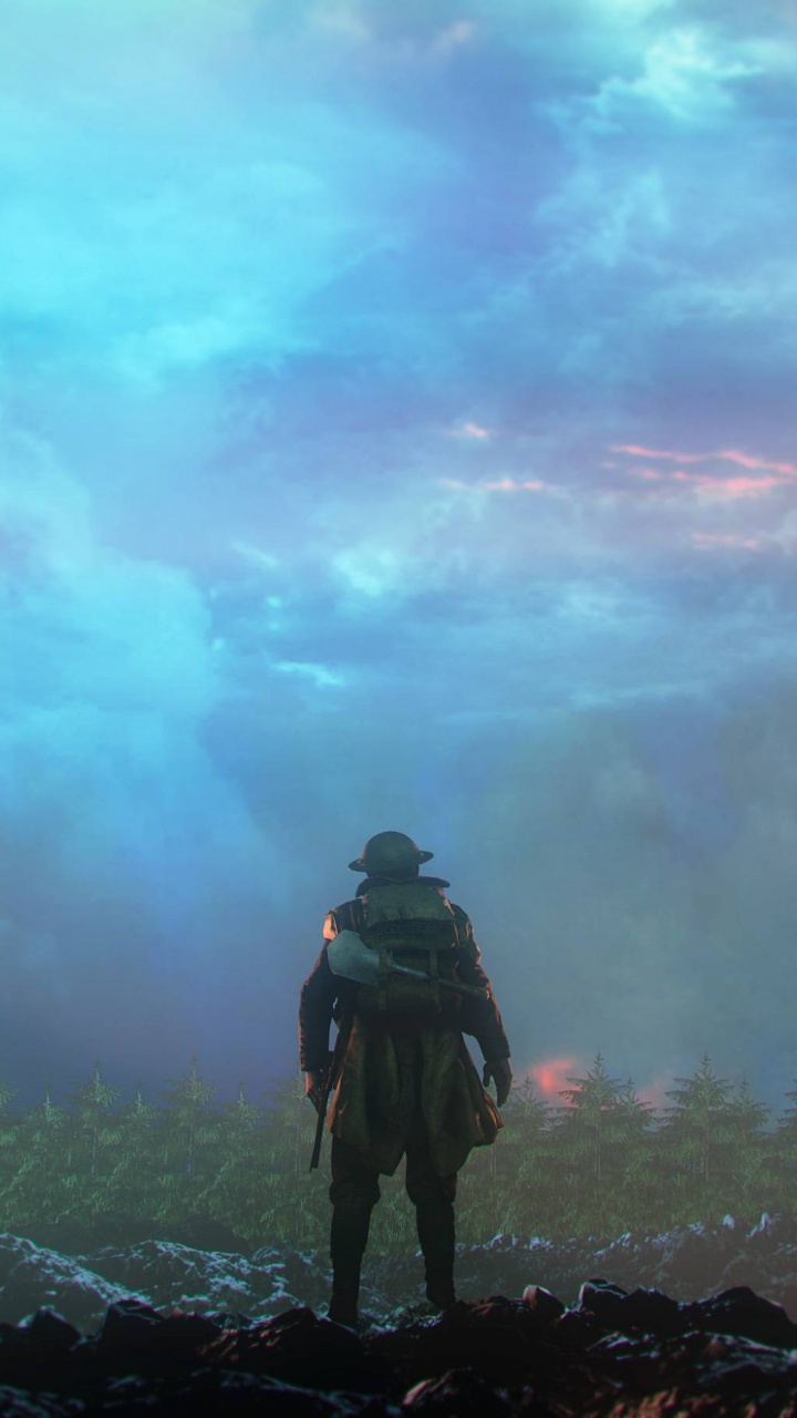 Hombre de Chaqueta Negra de Pie Sobre un Terreno Rocoso Bajo un Cielo Nublado Durante el Día. Wallpaper in 720x1280 Resolution