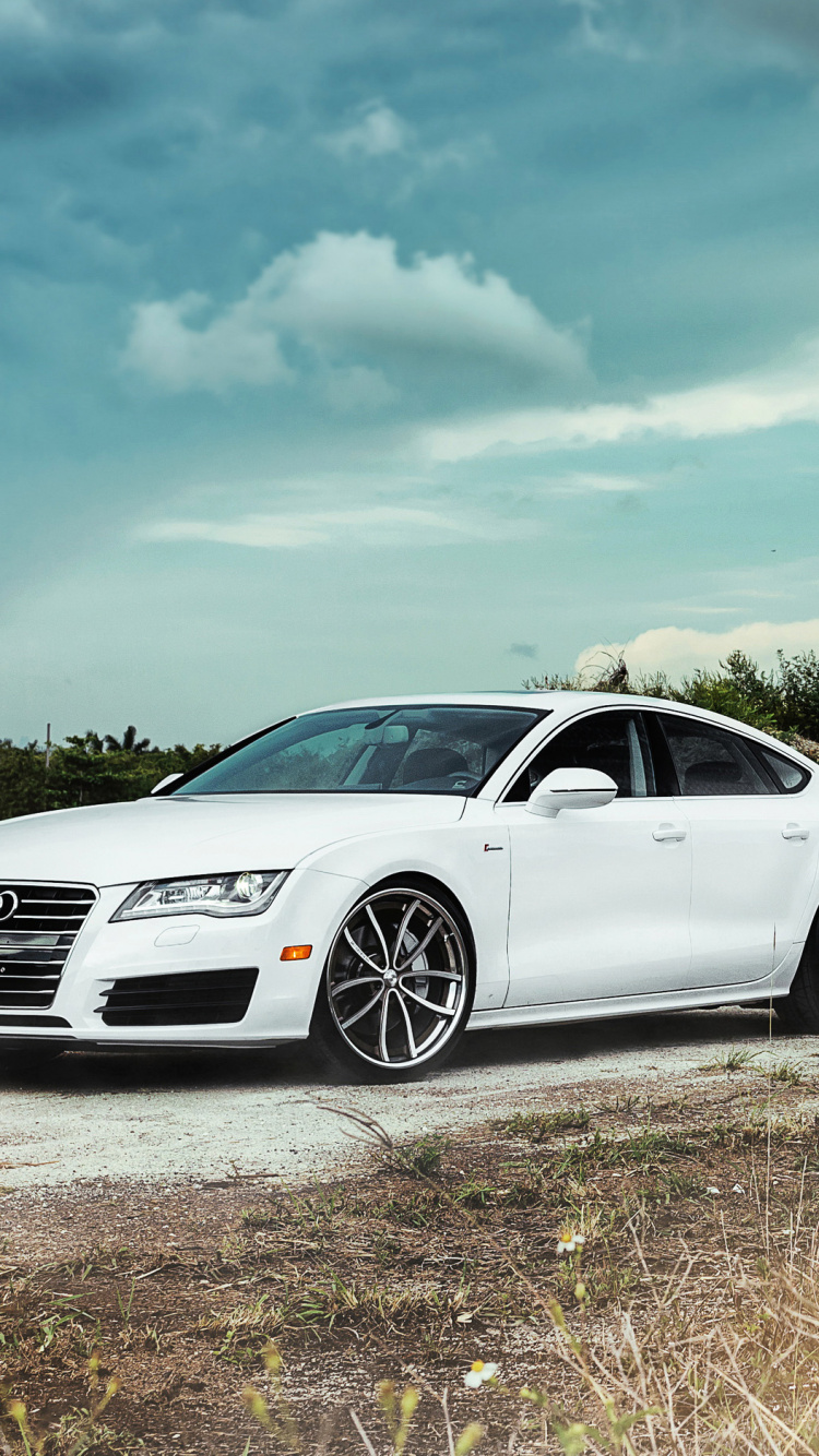 Weißes Mercedes Benz Coupé Auf Braunem Holzscheit Tagsüber. Wallpaper in 750x1334 Resolution