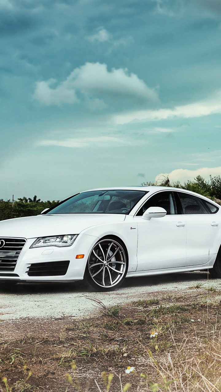 Mercedes Benz Coupe Blanco Sobre Troncos de Madera Marrón Durante el Día. Wallpaper in 720x1280 Resolution