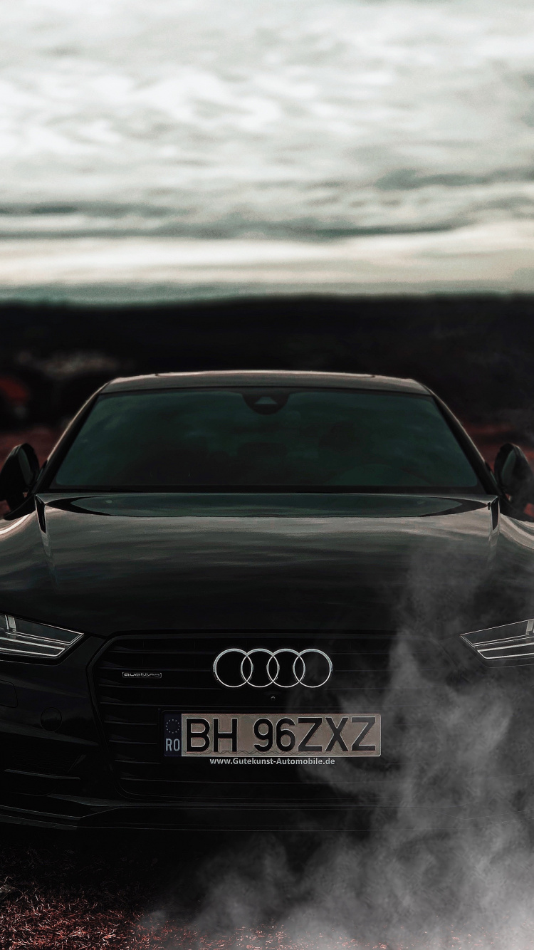 Schwarzer Audi a 4 Auf Unbefestigter Straße Tagsüber. Wallpaper in 750x1334 Resolution