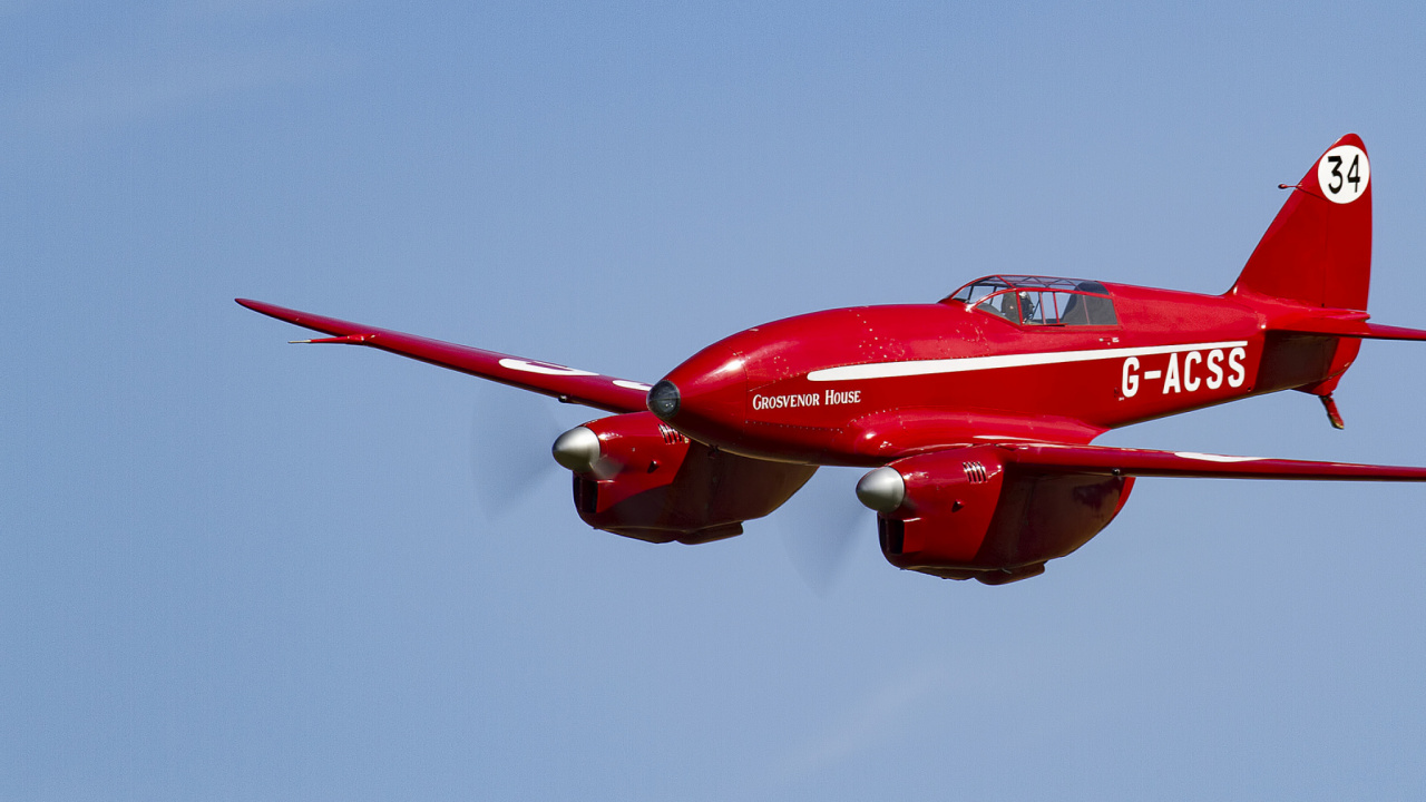 Red and White Jet Plane in Mid Air. Wallpaper in 1280x720 Resolution