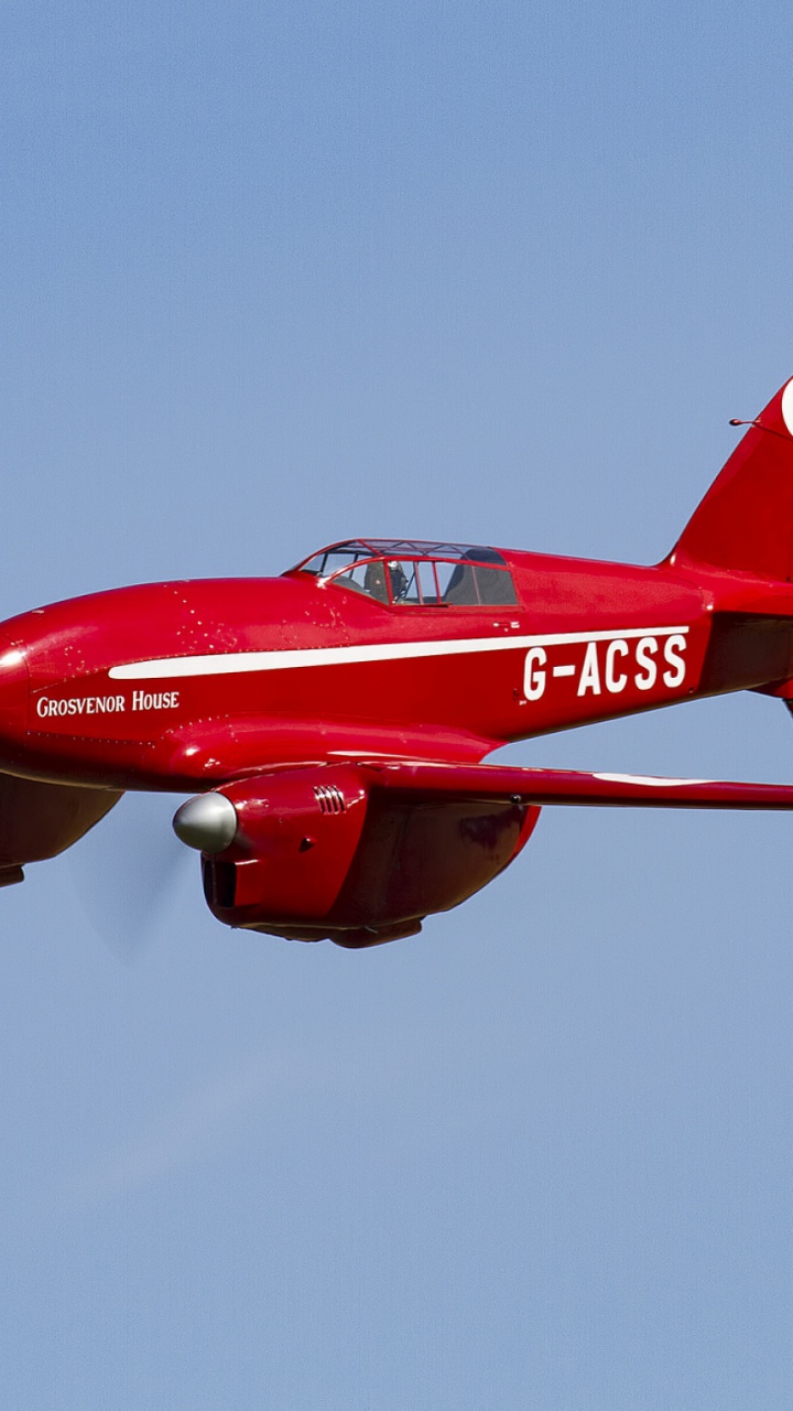 Red and White Jet Plane in Mid Air. Wallpaper in 720x1280 Resolution