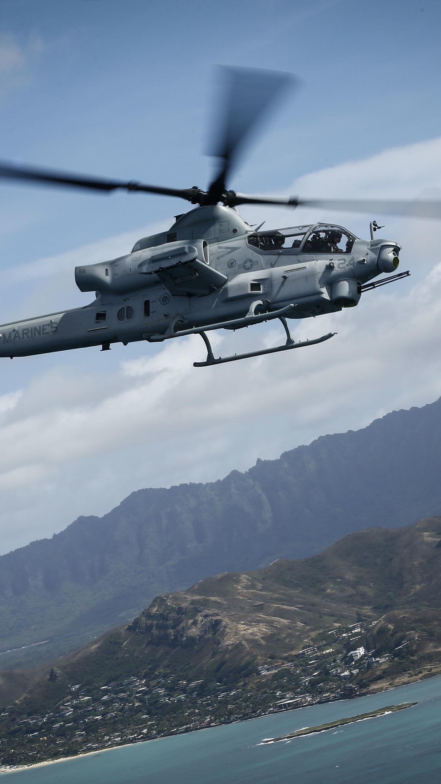 Black and White Helicopter Flying Over The Mountain During Daytime. Wallpaper in 1440x2560 Resolution