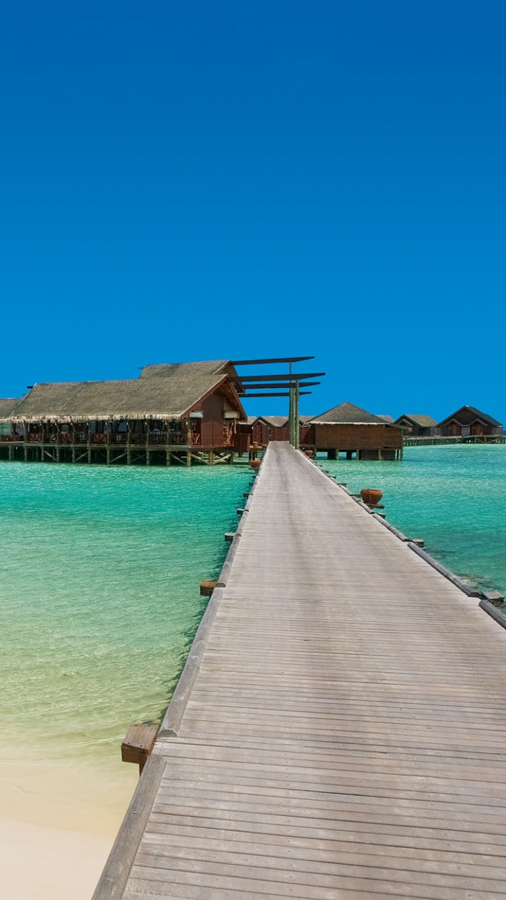Brown Wooden Dock on Sea During Daytime. Wallpaper in 720x1280 Resolution