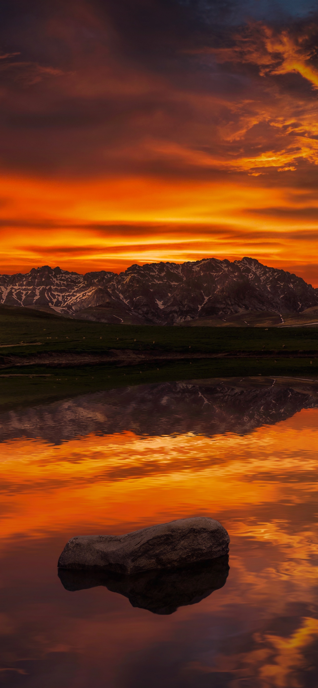 Snow Covered Mountain Near Body of Water During Daytime. Wallpaper in 1242x2688 Resolution