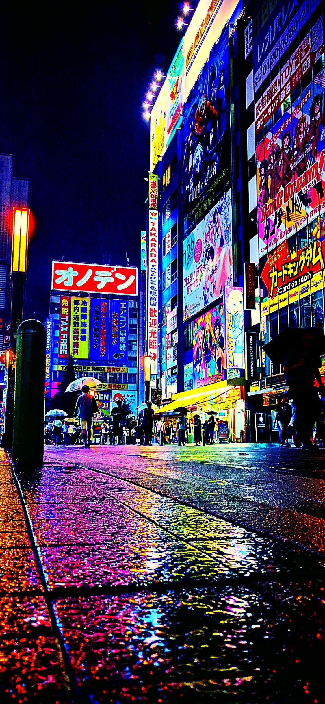 People Walking on Street During Night Time. Wallpaper in 1125x2436 Resolution