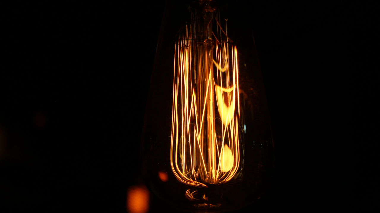 Clear Glass Light Bulb With Light. Wallpaper in 1280x720 Resolution