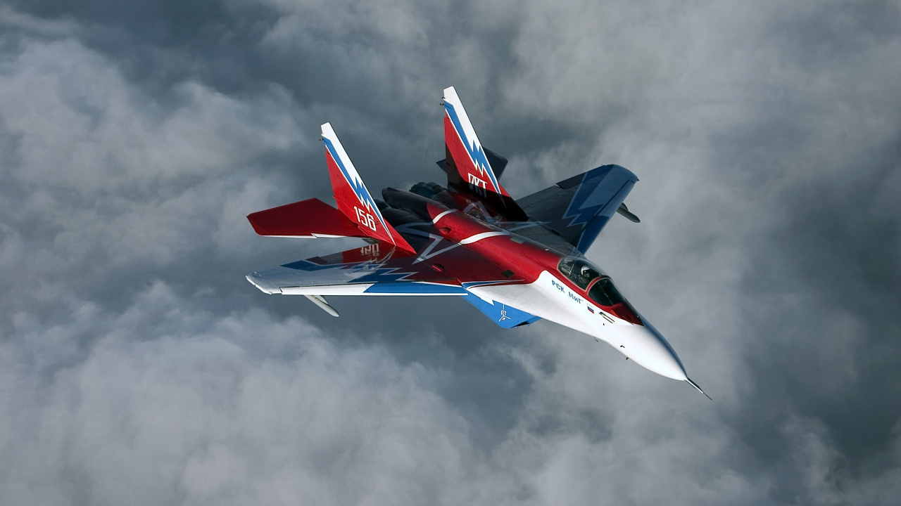 Red and White Jet Plane in Mid Air. Wallpaper in 1280x720 Resolution