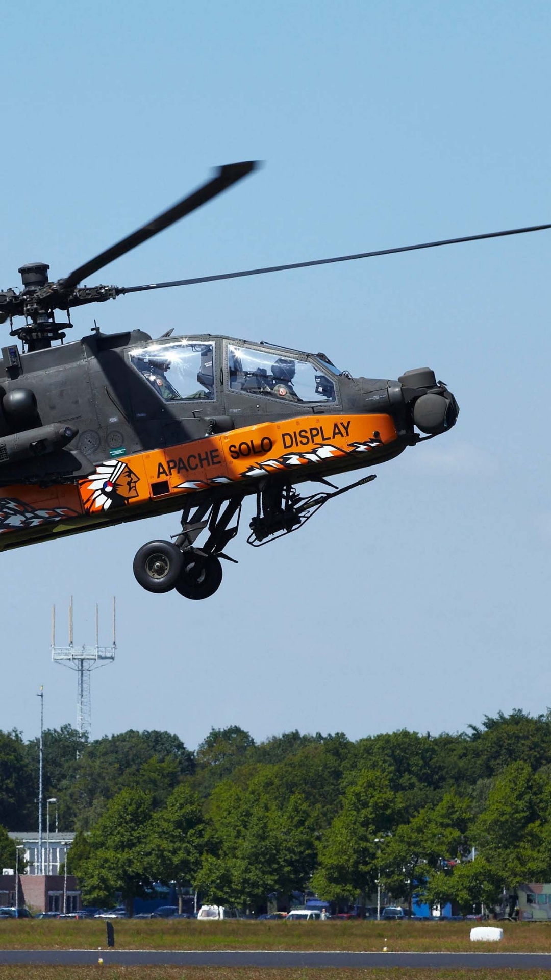 Black and Yellow Helicopter Flying Over Green Grass Field During Daytime. Wallpaper in 1080x1920 Resolution