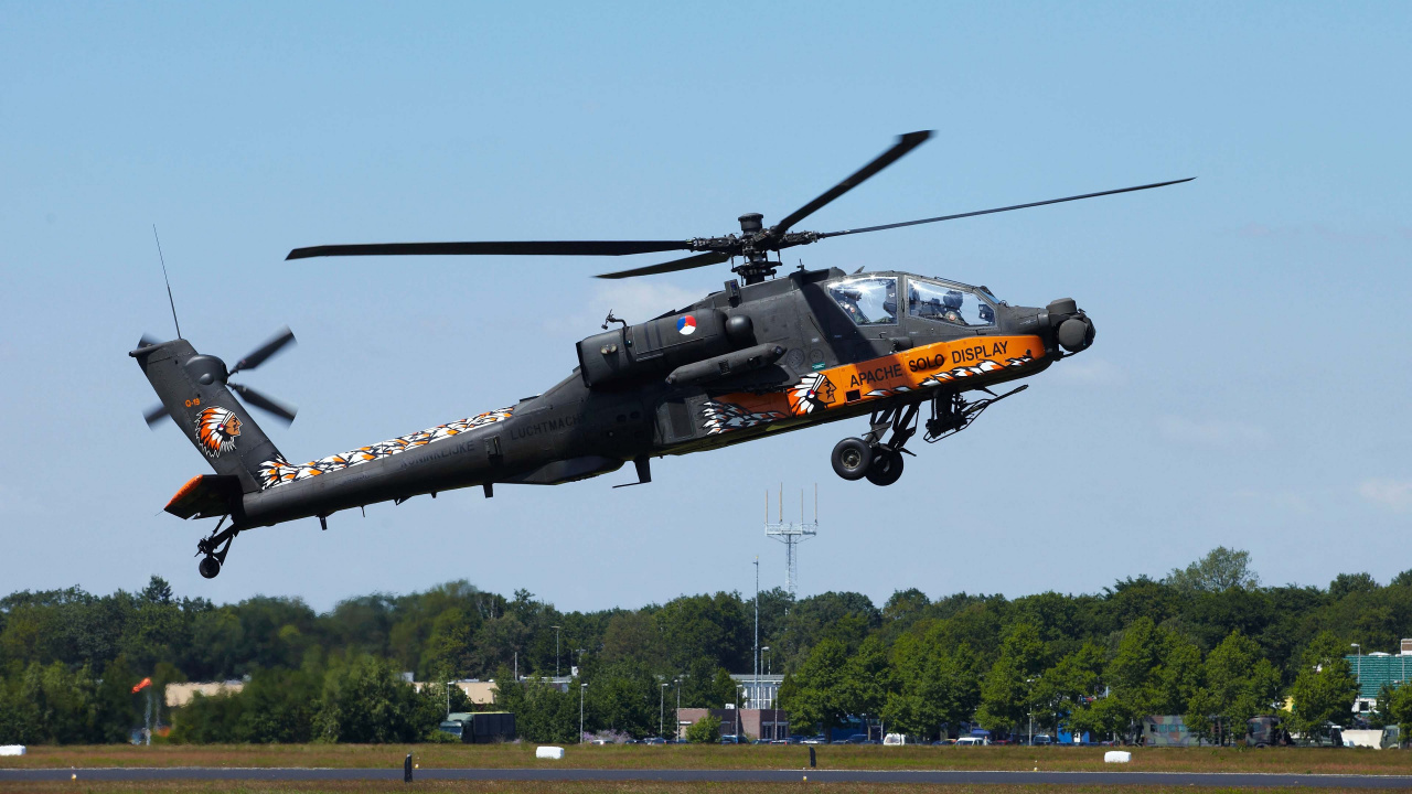 Black and Yellow Helicopter Flying Over Green Grass Field During Daytime. Wallpaper in 1280x720 Resolution