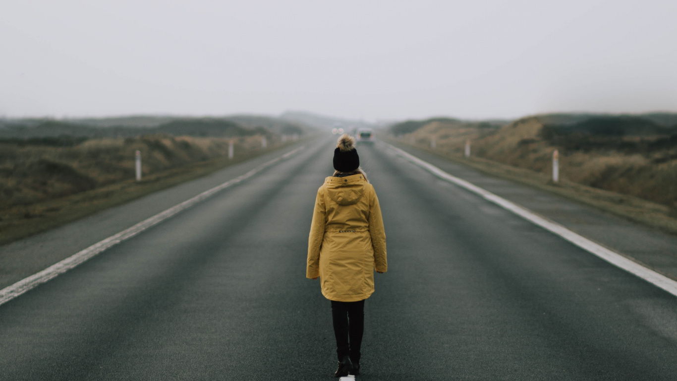 Woman in Brown Coat Standing on Road During Daytime. Wallpaper in 1366x768 Resolution