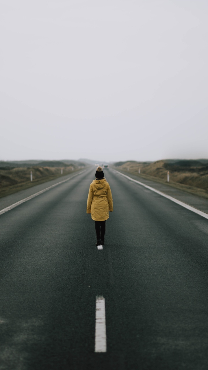 Woman in Brown Coat Standing on Road During Daytime. Wallpaper in 720x1280 Resolution