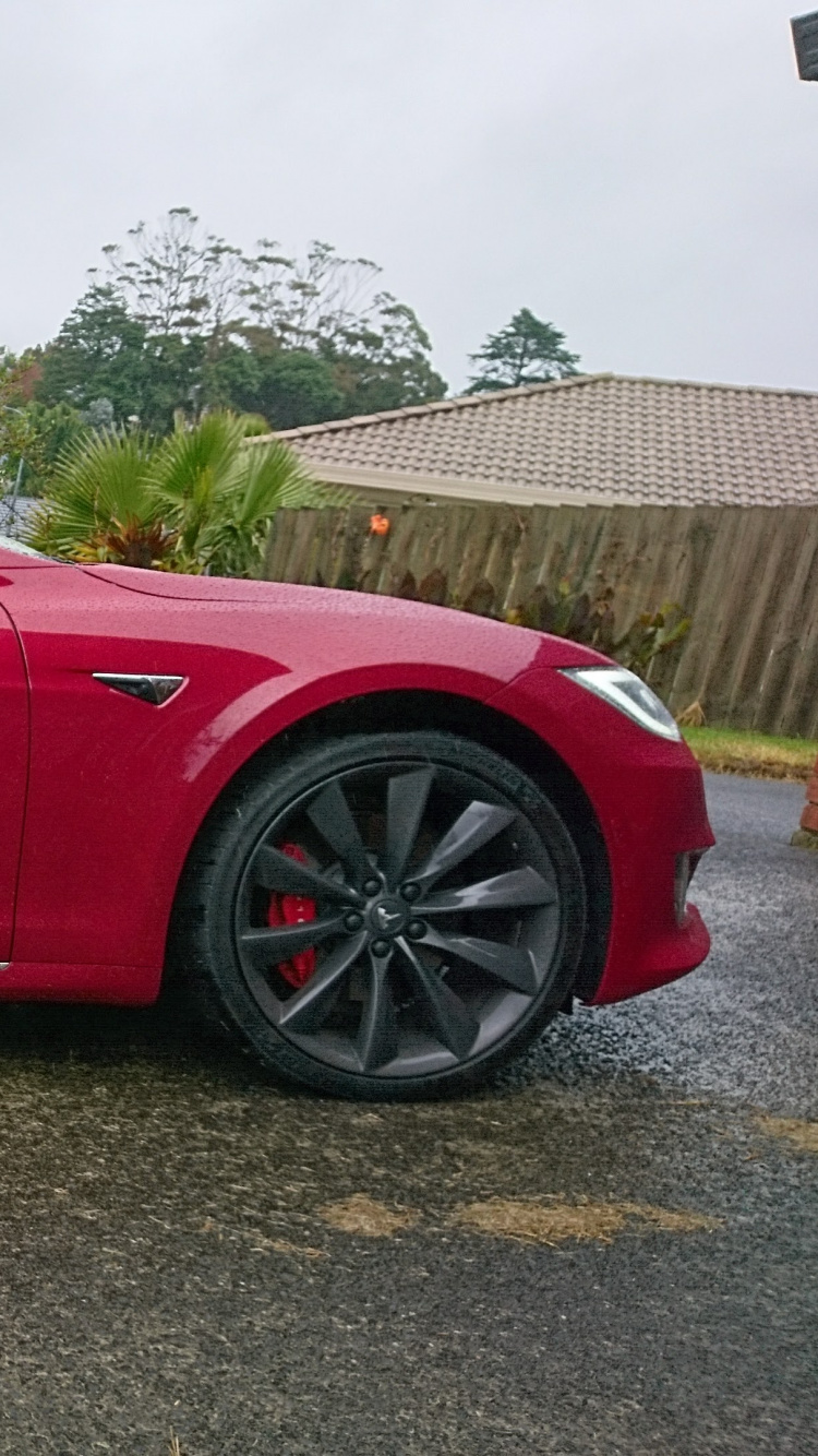 Red Sedan on Green Grass Field During Daytime. Wallpaper in 750x1334 Resolution