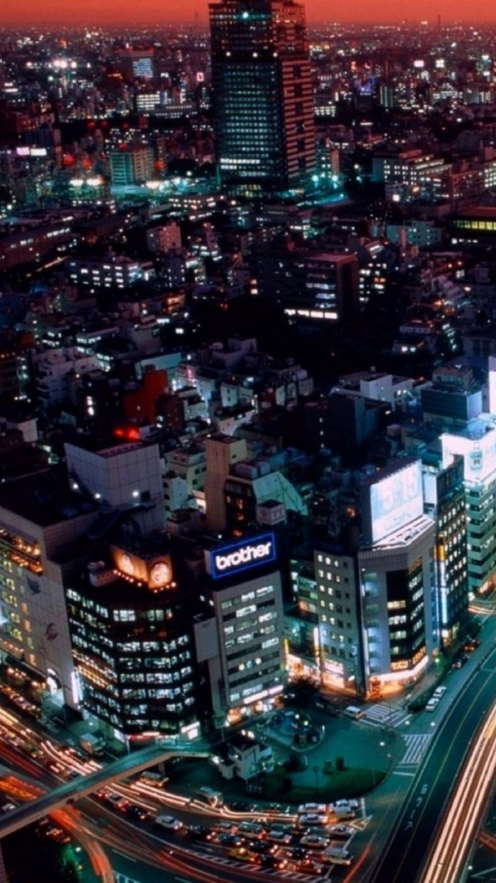 City With High Rise Buildings During Night Time. Wallpaper in 720x1280 Resolution