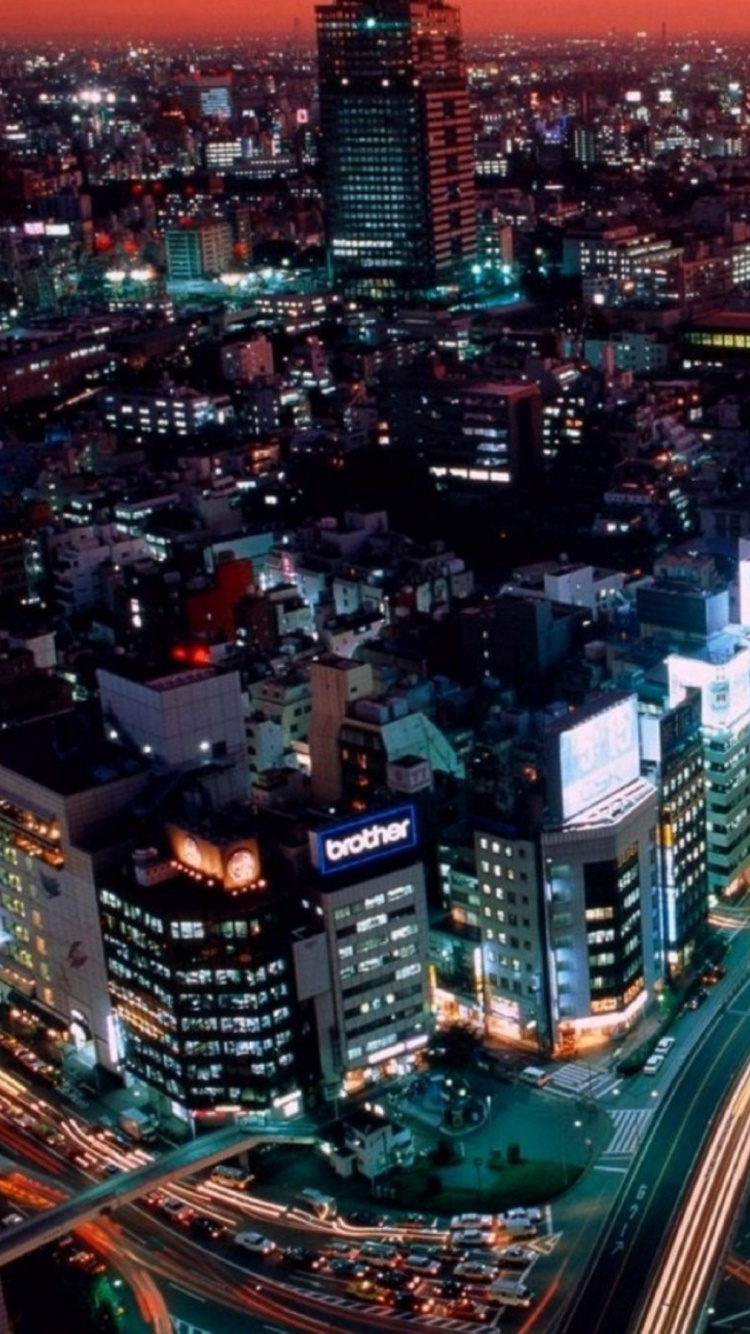 City With High Rise Buildings During Night Time. Wallpaper in 750x1334 Resolution
